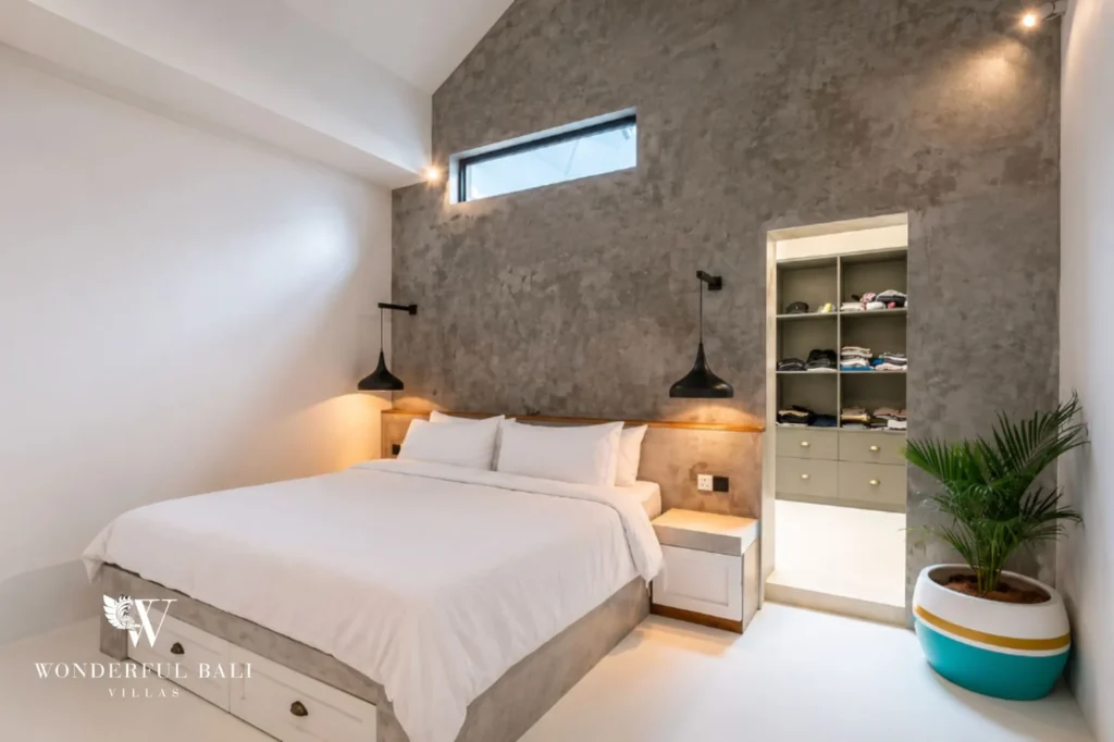 Bedroom with a concrete feature wall, 2-bedroom villa in Canggu