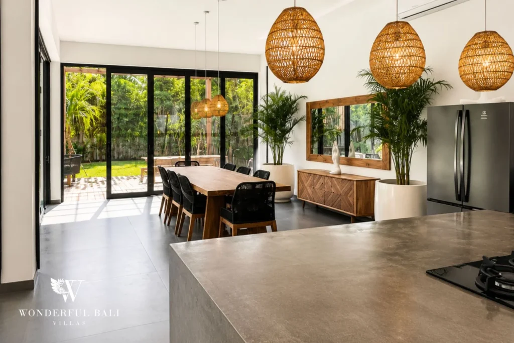 Open dining and kitchen with garden access at Luxury 3BR Villa in Pererenan, Bali