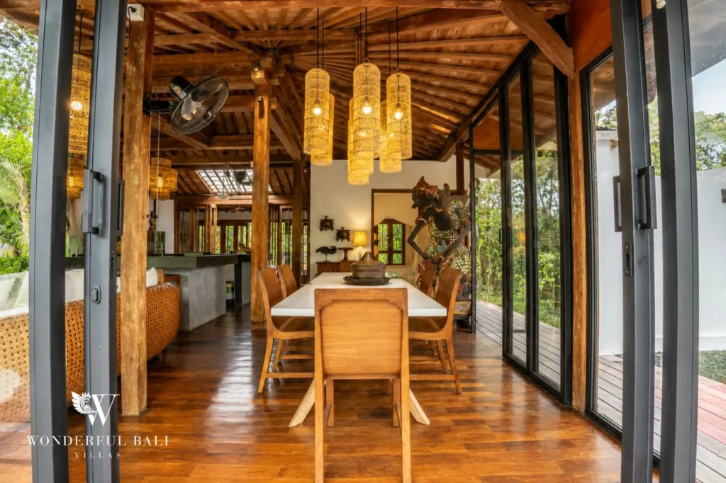 Joglo dining area opening onto garden and pool, 4-bedroom villa in Umalas