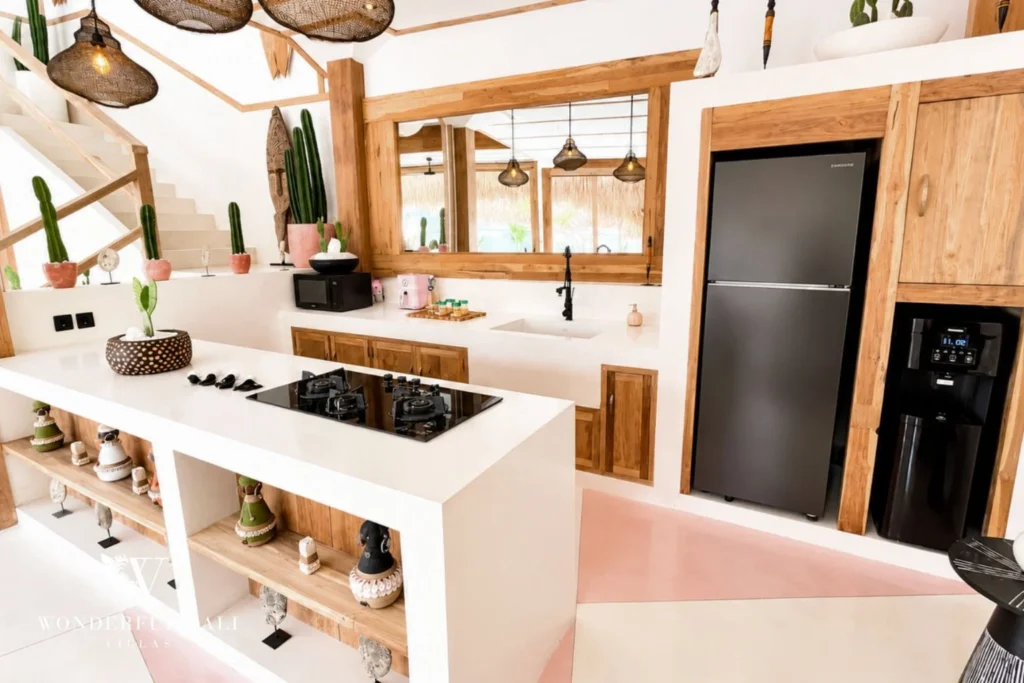 Open kitchen with adjoining staircase and cactus accents in Berawa, Bali