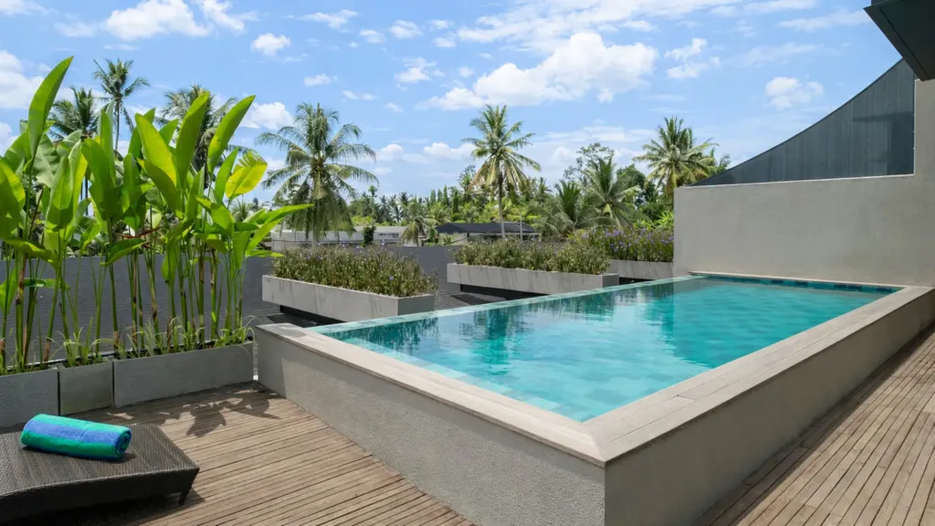 Villa Umahan, Ubud — pool, long pool framed by timber deck and tropical garden, Villa Umahan