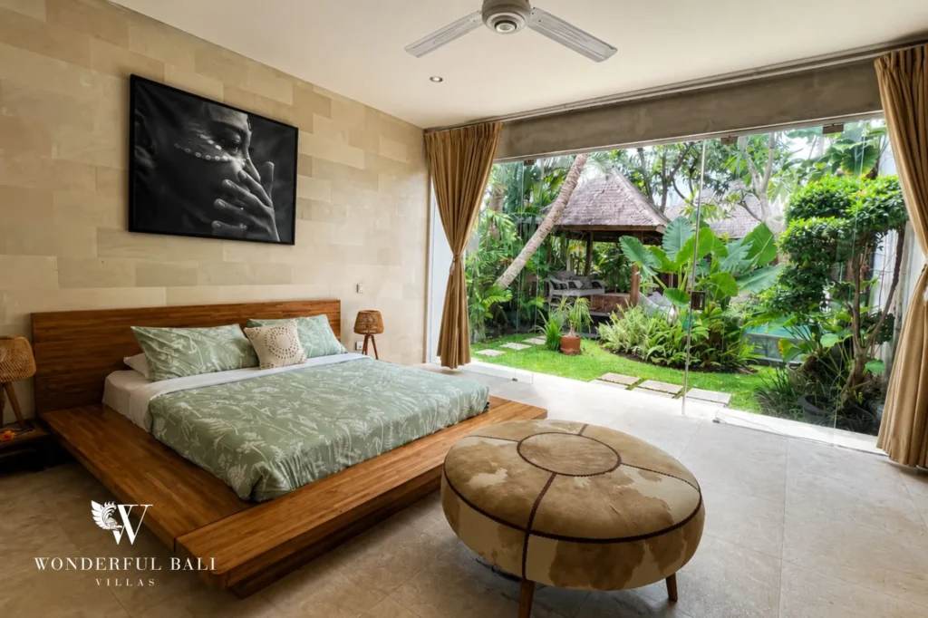 Bedroom with sliding doors to a tropical garden, 4-bedroom villa in Petitenget, Seminyak