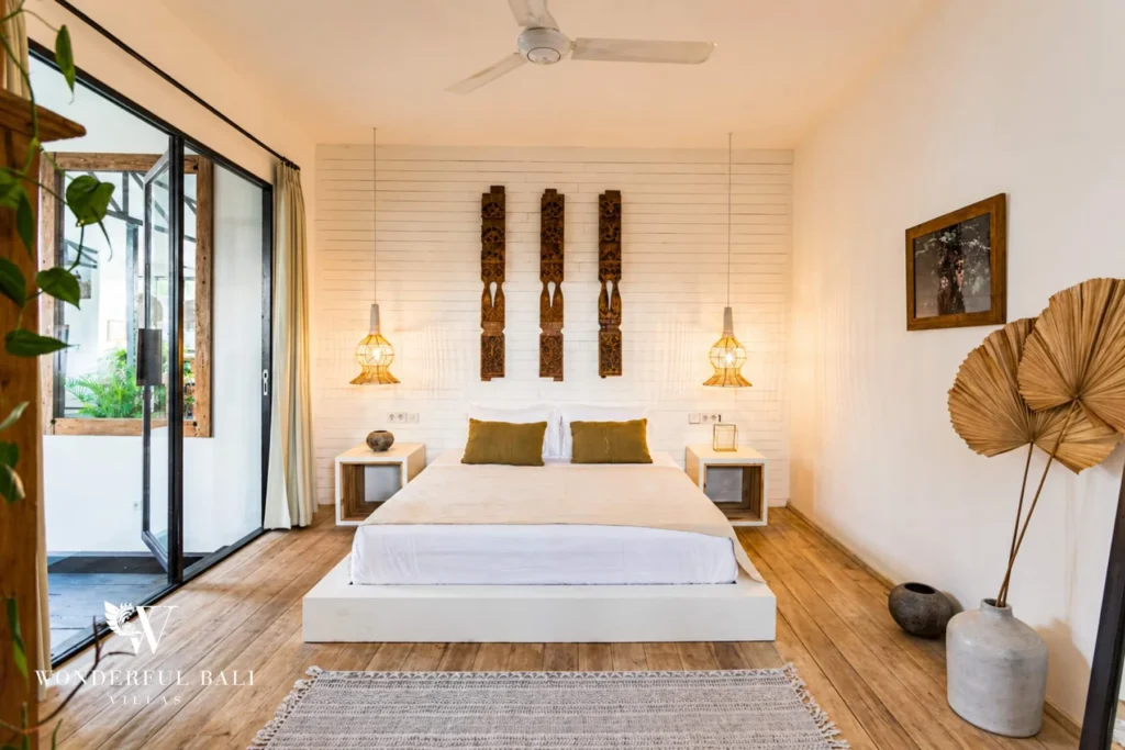 Third bedroom with garden access and palm-leaf decor in Umalas, Bali
