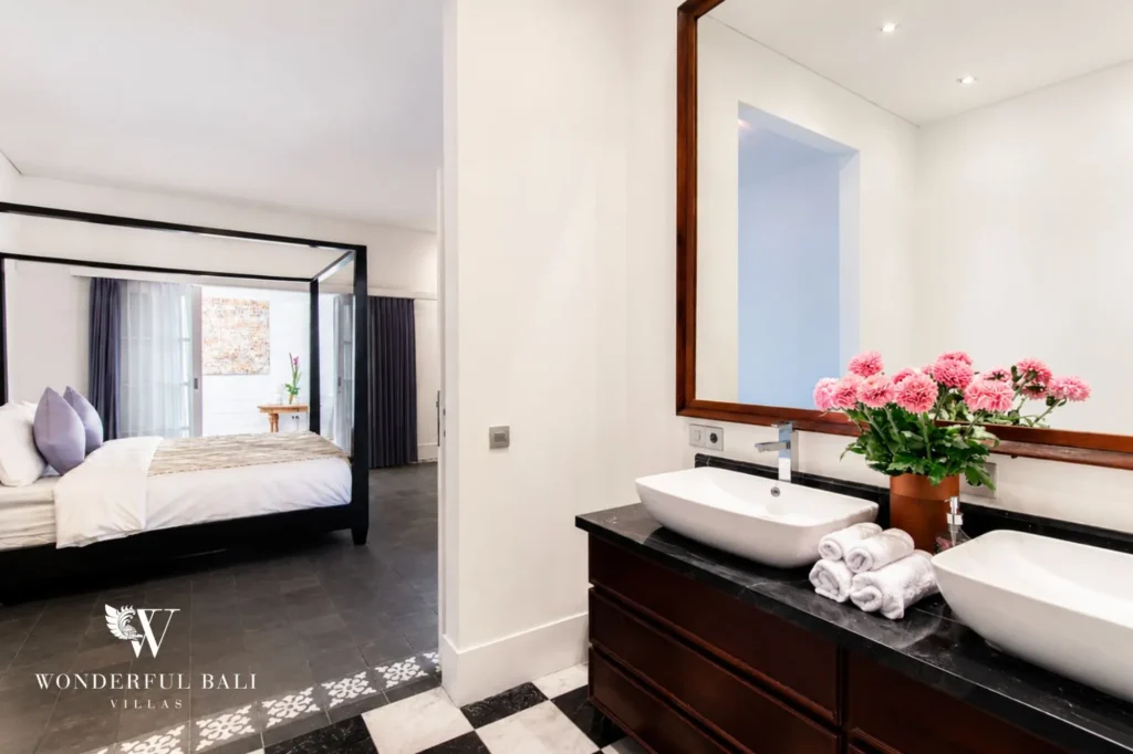 Modern bedroom with cut flowers and natural light, 3-bedroom colonial villa in Umalas