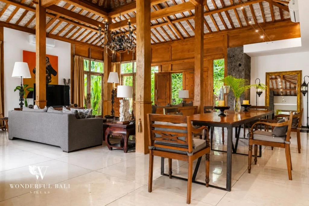 Living area with wooden ceiling beams and traditional finishes, 4-bedroom villa in Berawa, Canggu