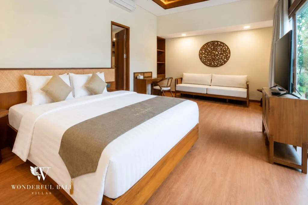 Second bedroom with king bed and seating area in Tumbak Bayuh, Bali