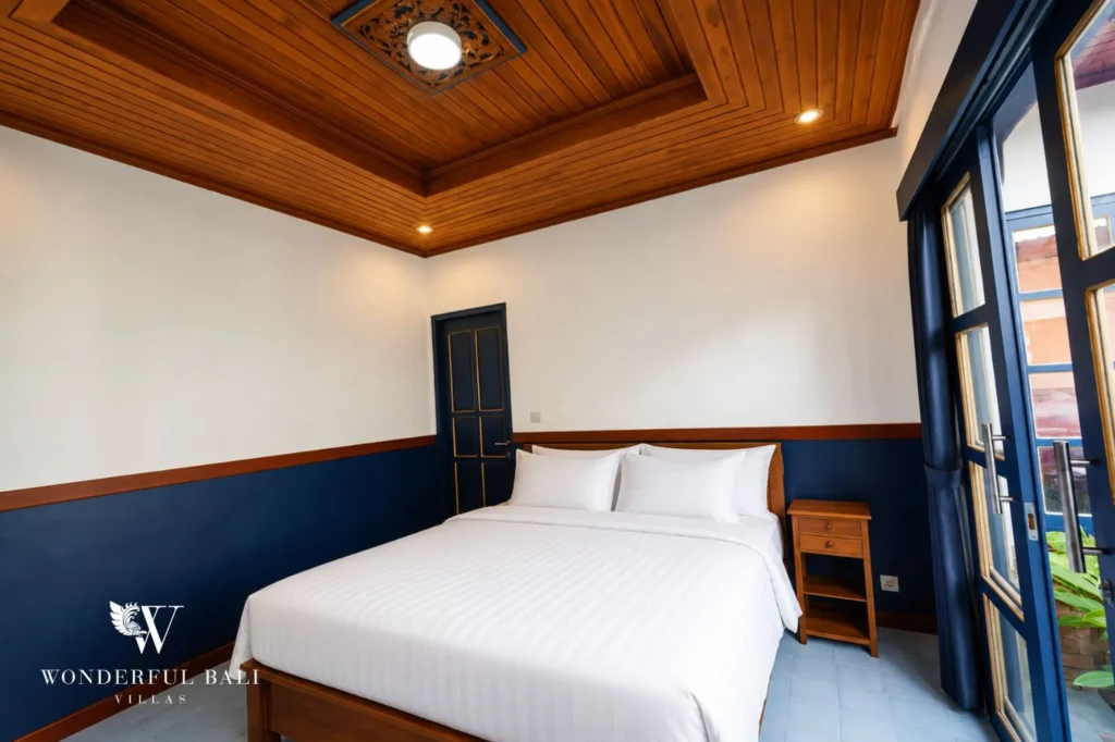 Bedroom with blue accent wall and wooden ceiling, 2-bedroom villa in Sanur