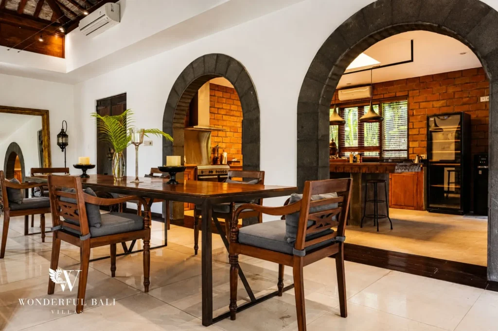 Dining area under a traditional alang-alang roof, 4-bedroom villa in Berawa, Canggu