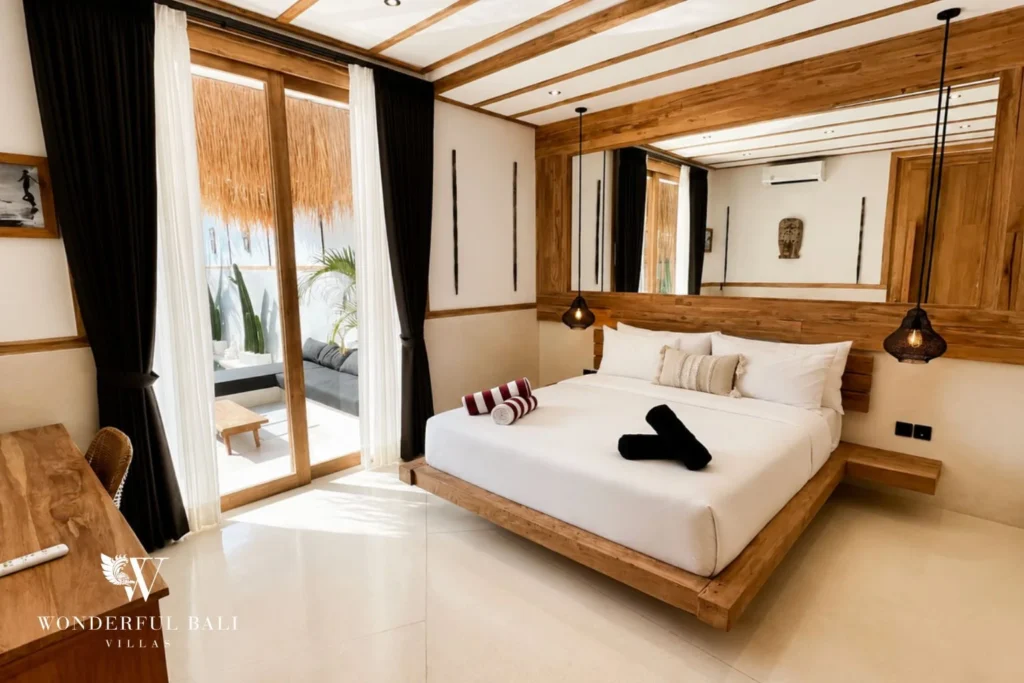 Master bedroom with timber-clad walls and king bed in Berawa, Bali