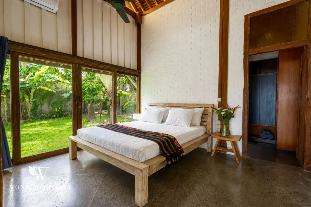 Bedroom with timber walls and garden view, 4-bedroom dual-villa compound in Pererenan