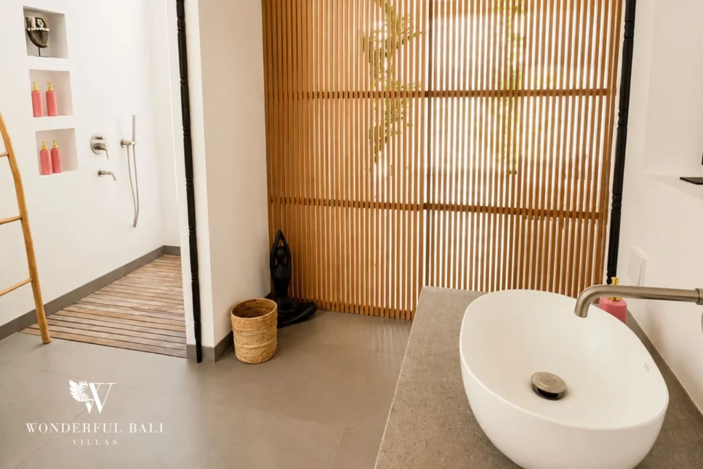 Bathroom with walk-in rainfall shower and timber screen at Luxury 3BR Villa in Pererenan, Bali