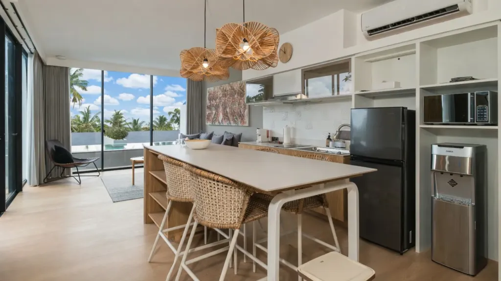 Villa Umahan, Ubud — kitchen, island with rattan pendants and dining seating, Villa Umahan