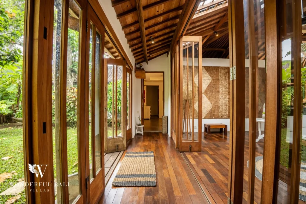 Bedroom with traditional carved Balinese furniture, 4-bedroom joglo villa in Umalas