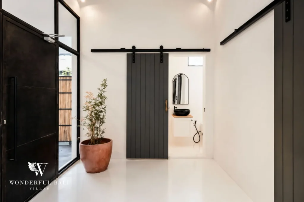 Hallway with a sliding barn door, 2-bedroom villa in Canggu