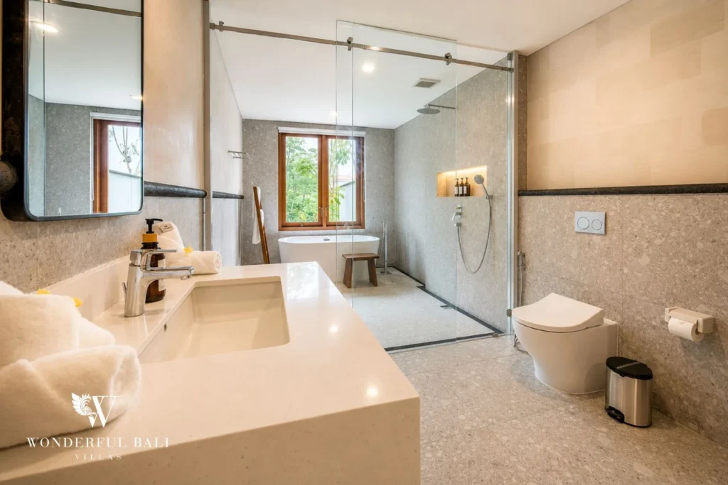 Master bathroom with rainfall shower, bathtub and double vanity in Tumbak Bayuh, Bali