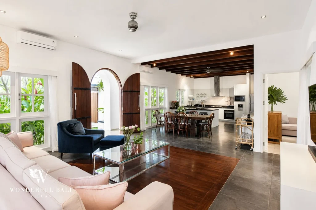 Living room sofa area with art and natural light, 3-bedroom colonial villa in Umalas