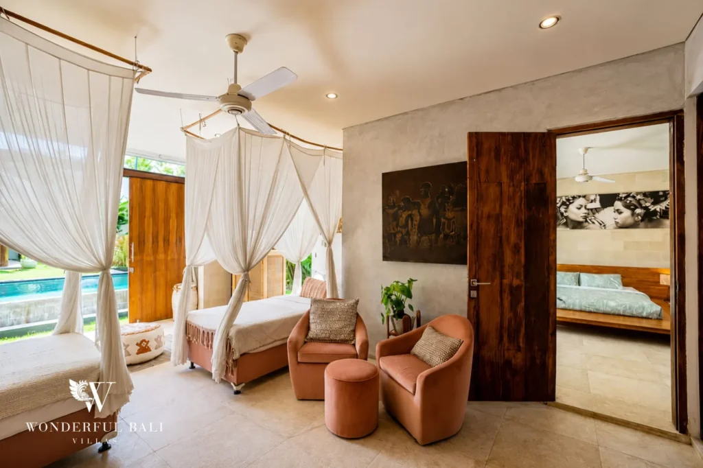 Bedroom with full-length curtains and garden access, 4-bedroom villa in Petitenget, Seminyak