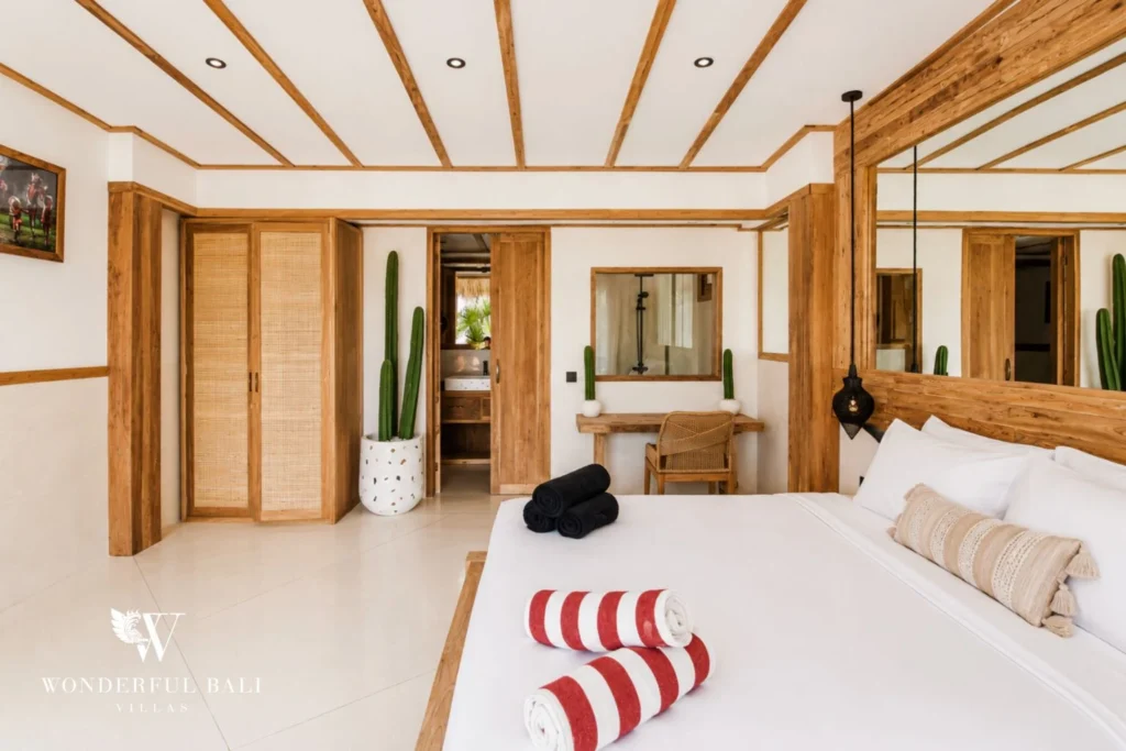 Bedroom with rattan wardrobes and cactus accents in Berawa, Bali