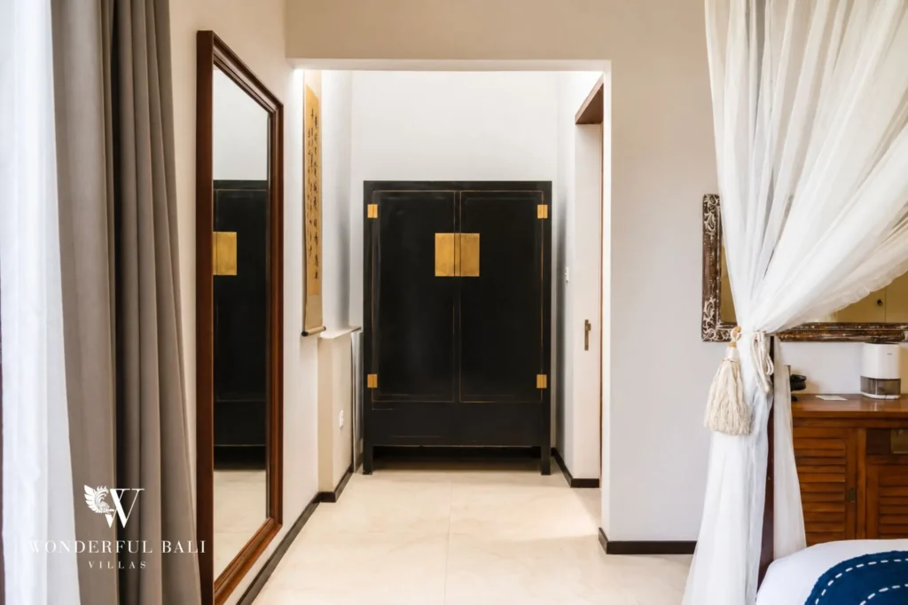 Bedroom opening to a private balcony with garden view, 4-bedroom villa in Berawa, Canggu
