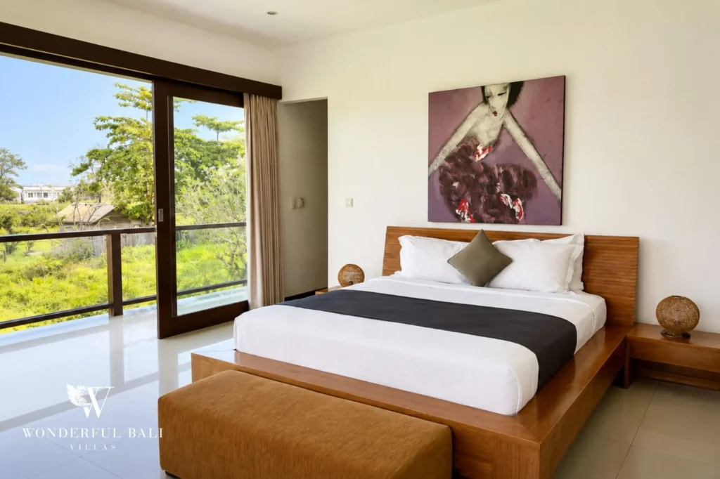 Bedroom with canopy bed and garden view, 5-bedroom villa in Batu Bolong, Canggu