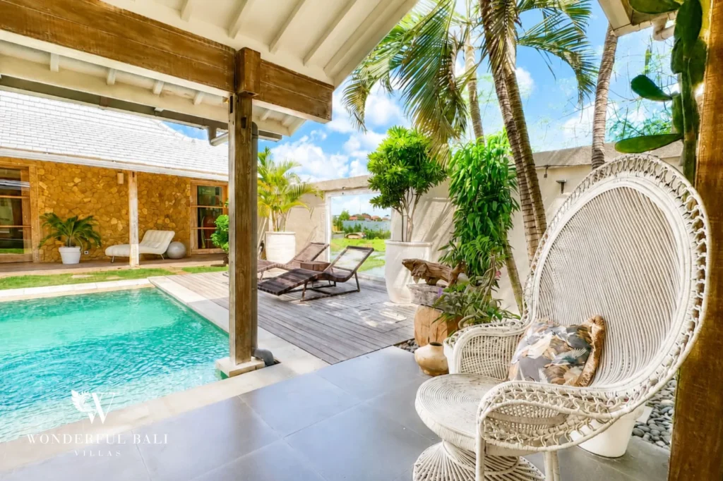 Outdoor pool area with hanging chair, 4-bedroom family villa in Mertasari, Kerobokan