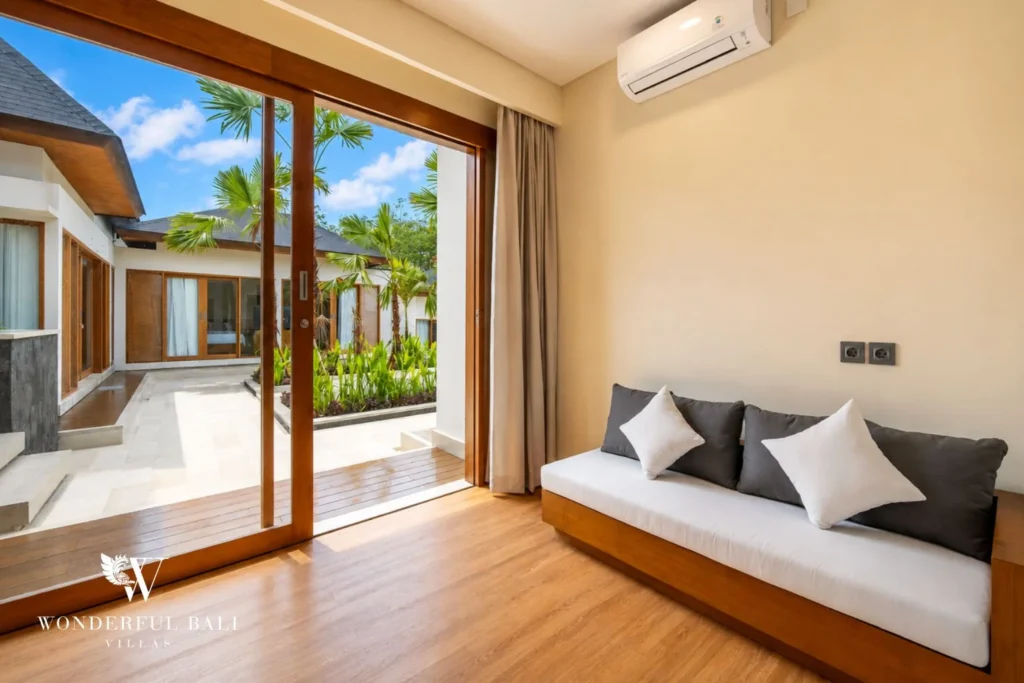 Sitting area with daybed and inner courtyard view in Tumbak Bayuh, Bali