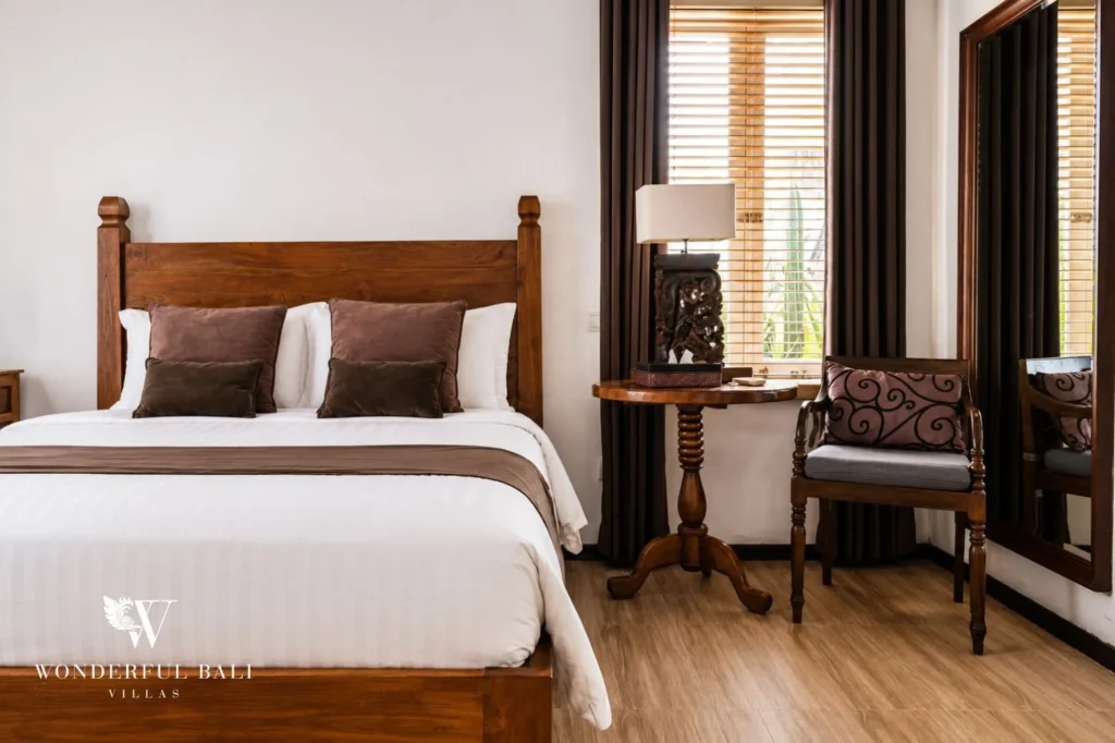 Bedroom with garden view through window, 4-bedroom villa in Berawa, Canggu