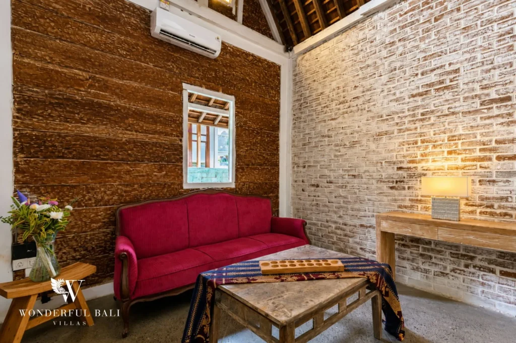 Bedroom with red-toned bed and timber walls, 4-bedroom dual-villa compound in Pererenan
