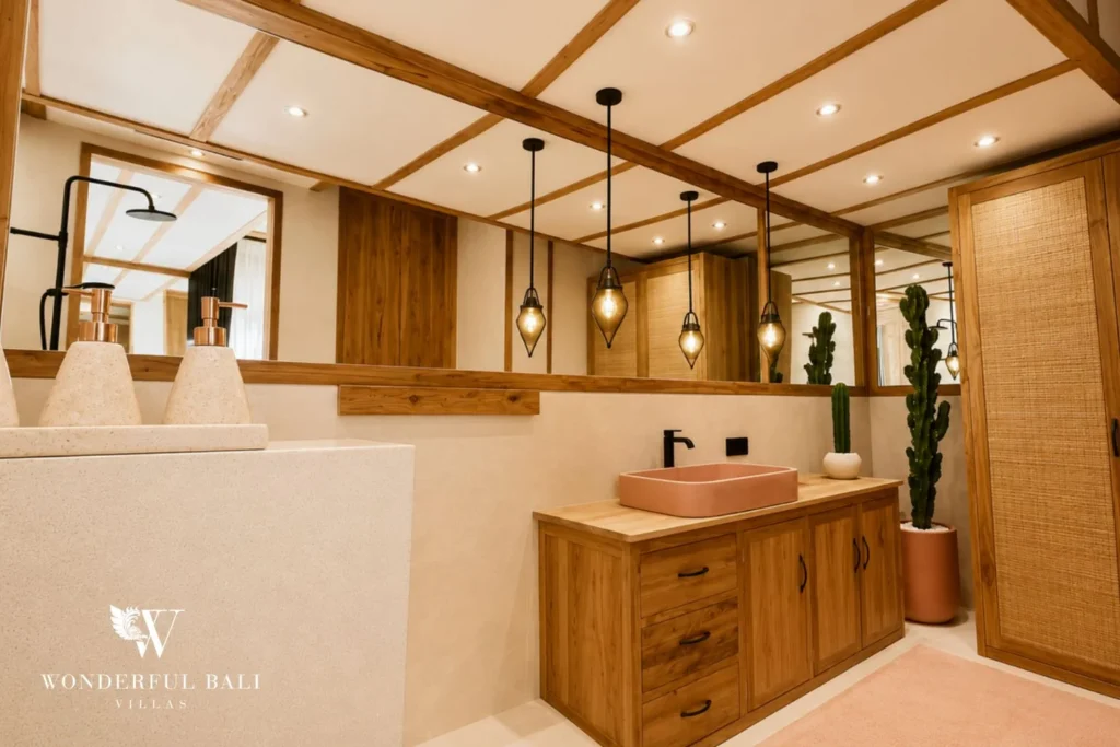 Boho bathroom with pink terrazzo sink and cactus in Berawa, Bali