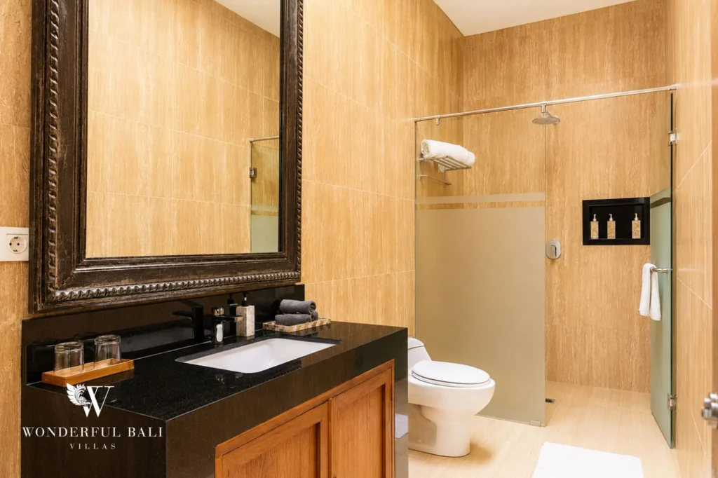 Bathroom with walk-in shower and traditional finishes, 4-bedroom villa in Berawa, Canggu