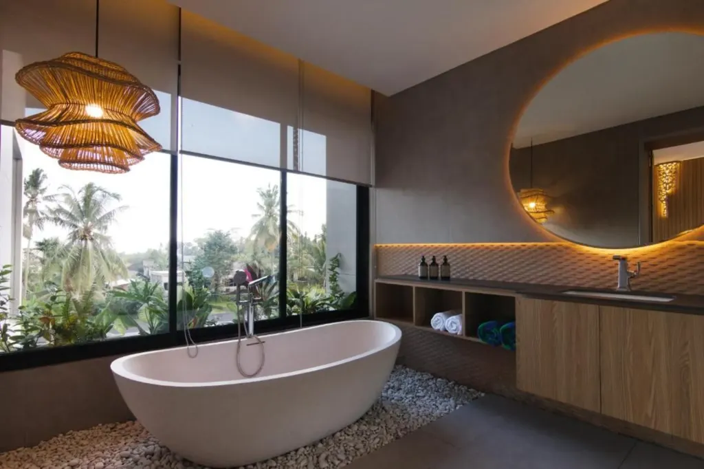 Villa Umahan, Ubud — bathroom, freestanding tub, rattan pendant and jungle view, Villa Umahan