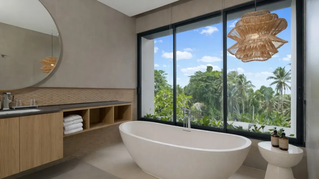 Villa Umahan, Ubud — bathroom, freestanding bathtub, large rattan pendant and tropical view, Villa Umahan