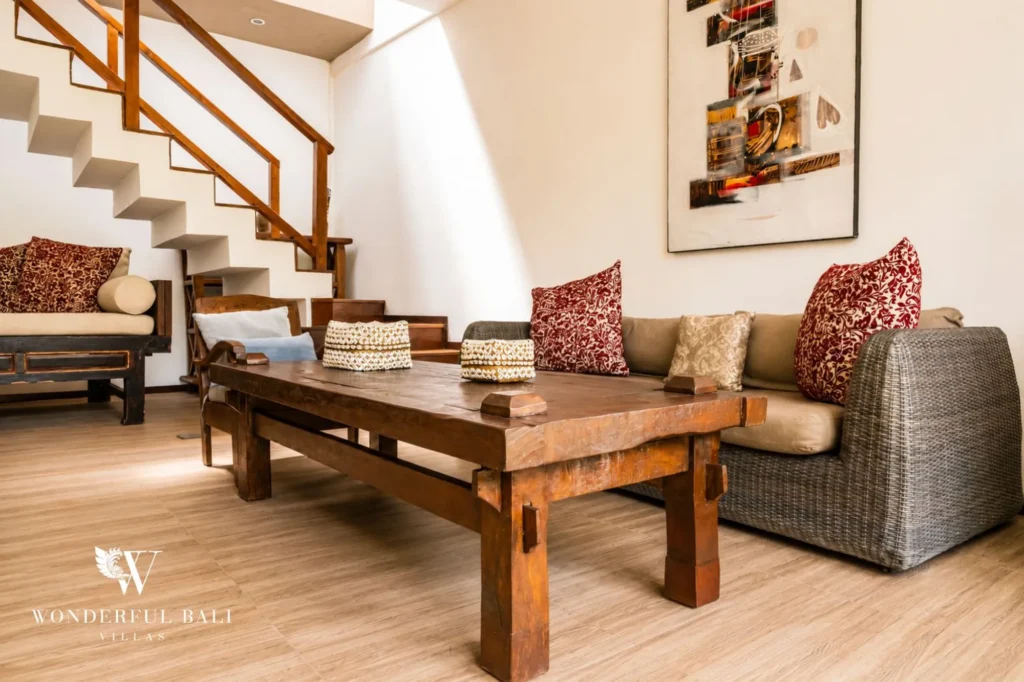 Indoor lounge area with sofa and natural materials, 4-bedroom villa in Berawa, Canggu