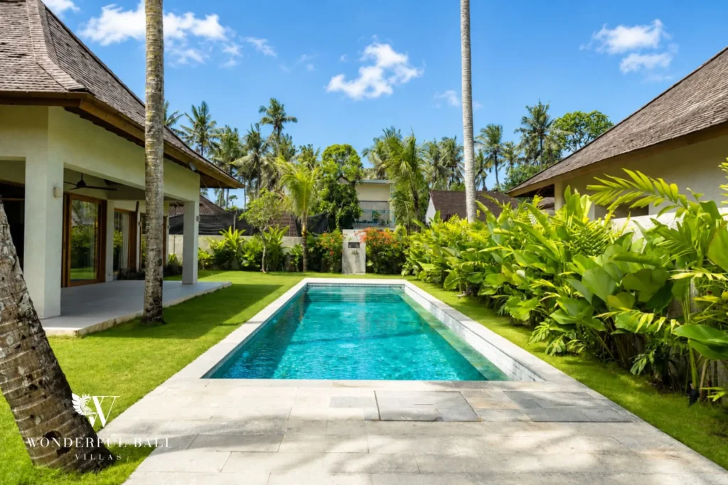 Private pool framed by palm trees, 4-bedroom villa in Kaba-Kaba, Tabanan