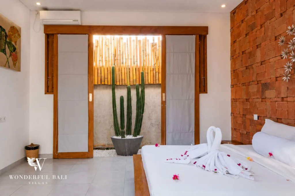 Master bedroom with rustic terracotta brick walls, 2-bedroom villa in Jimbaran, Bukit