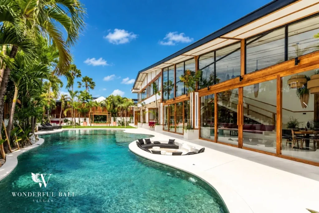 Infinity-edge pool and tropical villa exterior at family villa in Umalas, Bali