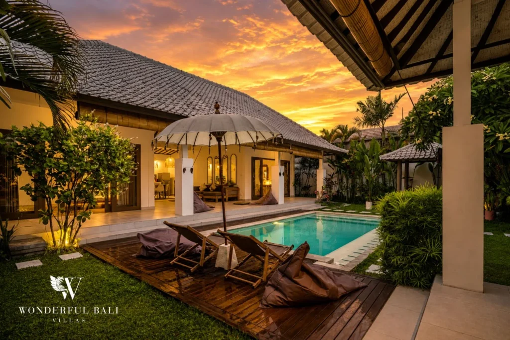 Covered outdoor lounge with sofa beside the pool at villa in Umalas, Bali