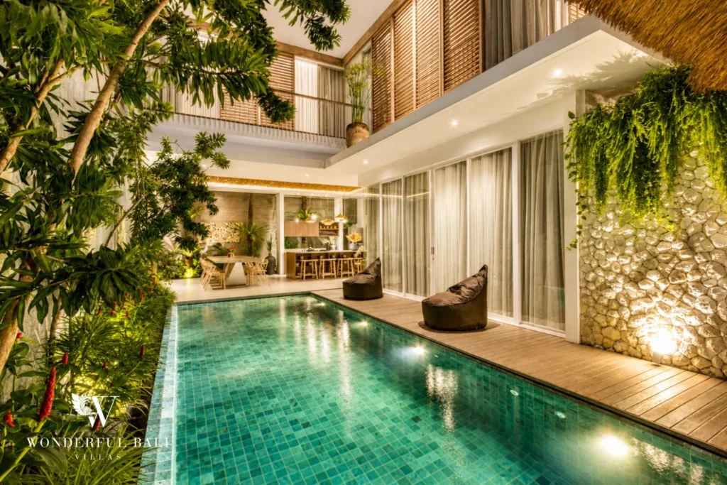 Private pool with poolside bale and sun loungers at villa in Petitenget, Bali