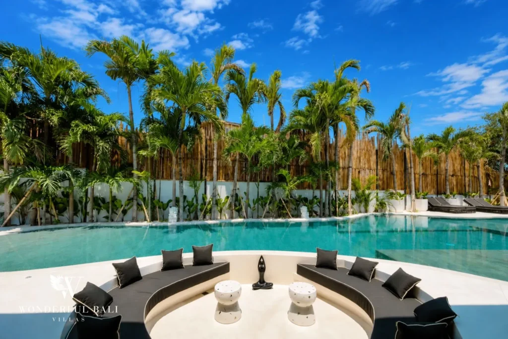 Poolside sunken lounge with fire pit at family villa in Umalas, Bali
