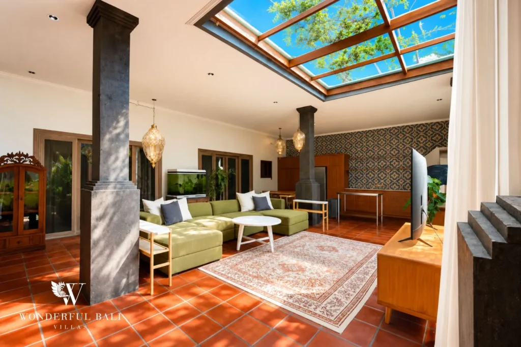 Living pavilion with columns and warm terracotta-tiled floor at villa in Canggu, Bali