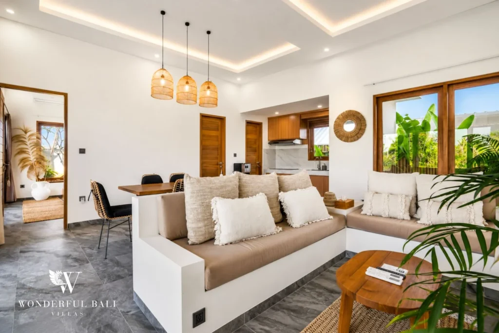 Open living room with sofa and plants at villa in Ubud, Bali