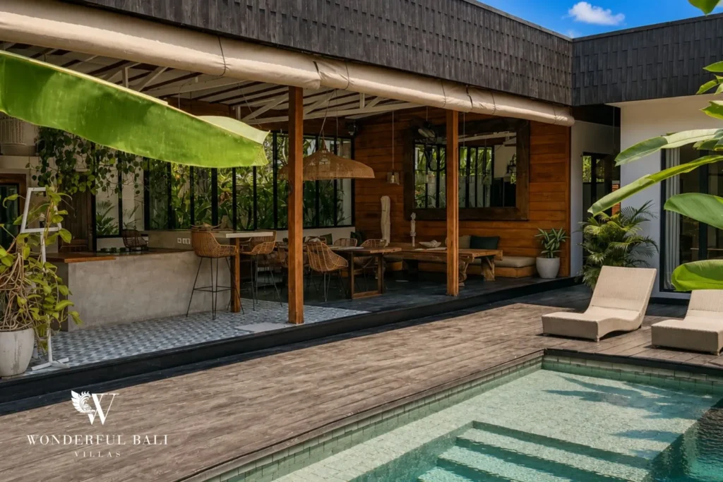 Open-air lounge with sofa overlooking the pool at villa in Canggu, Bali
