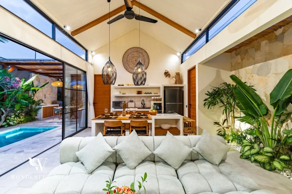 Open-plan living and dining under a timber ceiling at villa in Seseh, Bali