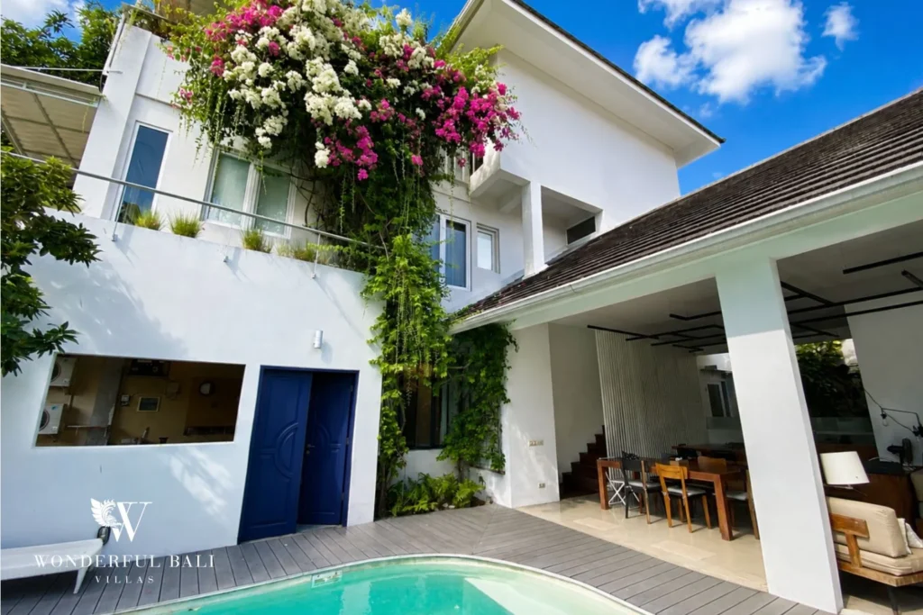 Two-story villa with bougainvillea facade and private pool in Umalas, Bali