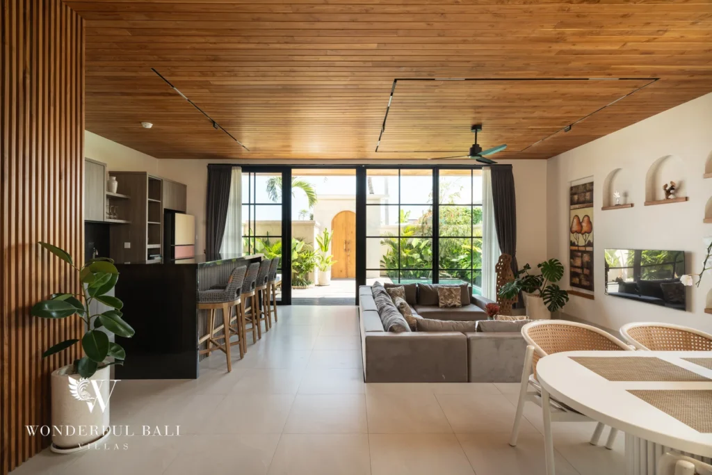 Bright open-plan living and dining opening to the outdoors at villa in Umalas, Bali