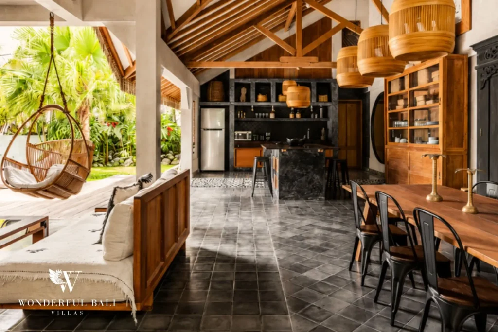 Open-plan kitchen, bar and dining area with hanging chair at a villa in Canggu, Bali