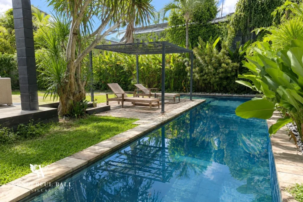 monthly villa rental sanur — private pool loungers garden