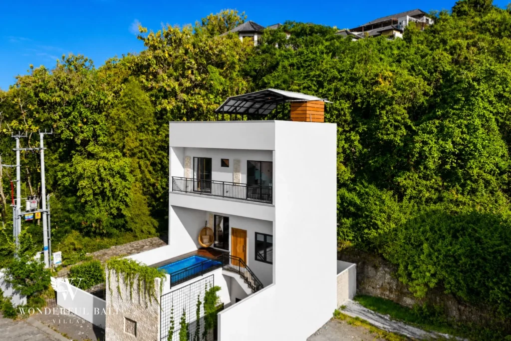 3BR villa for monthly rent Jimbaran — villa exterior with tropical garden