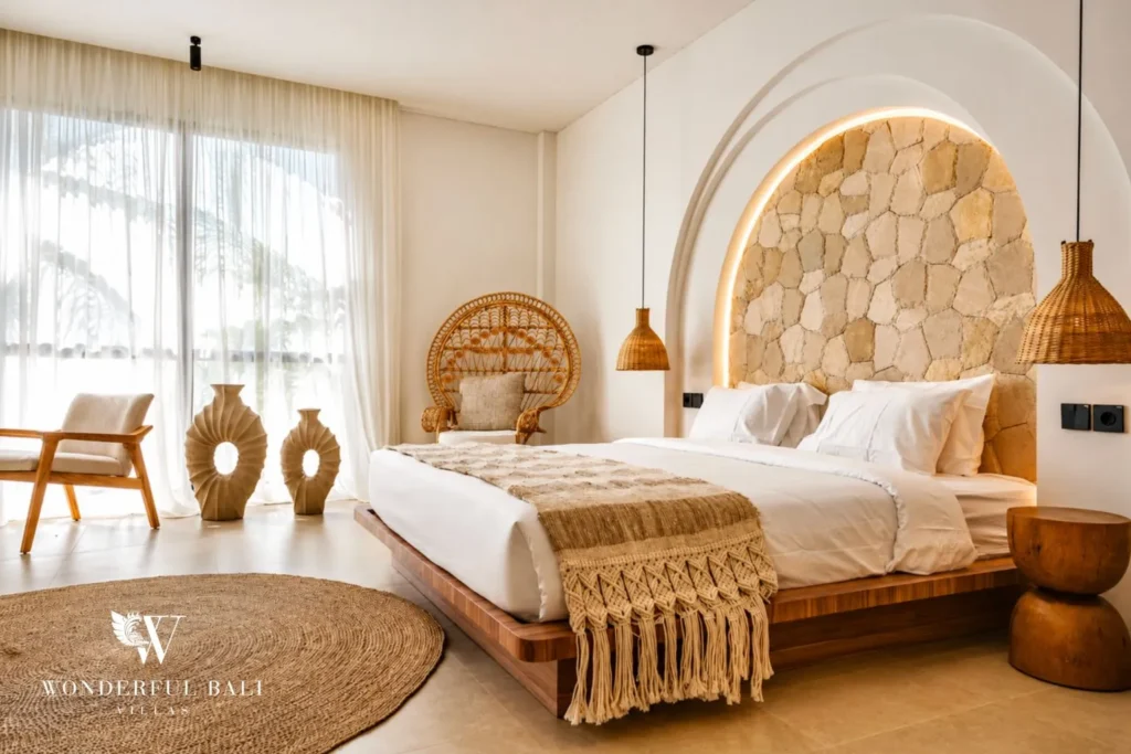 Bedroom with arched niche and woven headboard at villa in Umalas, Bali