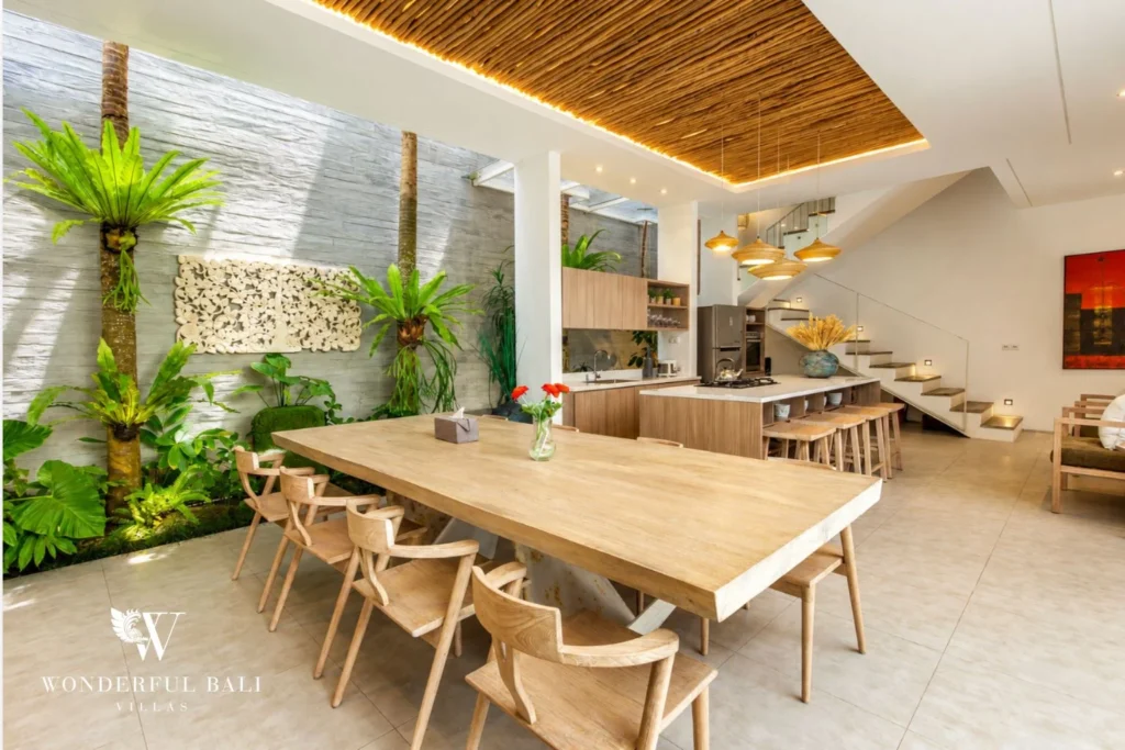 Open-plan kitchen and dining area with high ceiling at villa in Petitenget, Bali